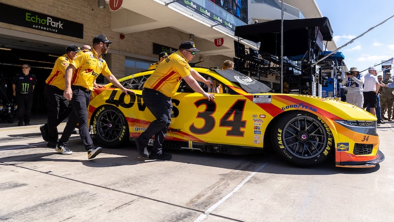 Team members for Todd Gilliland move his car onto pit road before a NASCAR Cup Series auto...