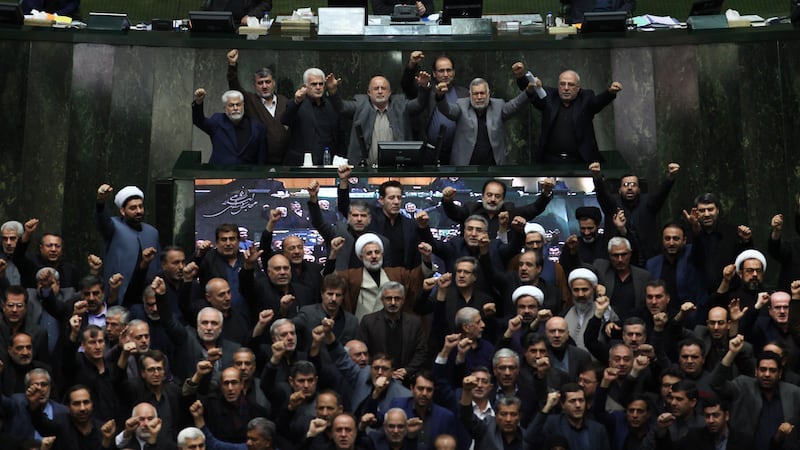 Iranian lawmakers chant anti-American and anti-Israeli slogans to protest against the U.S....