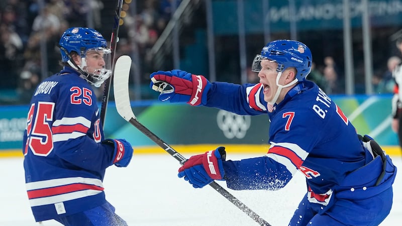 United States' Brady Tkachuk, right, celebrates after scoring his side's second goal during a...