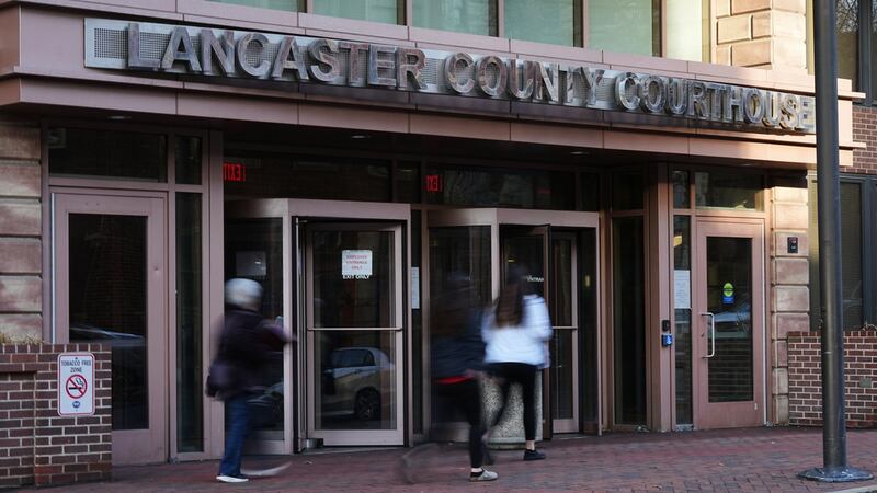 People enter the Lancaster County Courthouse in Lancaster, Pa., Wednesday, March 25, 2026.