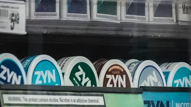 FILE - Containers of Zyn, a Phillip Morris smokeless nicotine pouch, are displayed for sale...